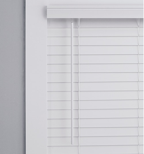 Close up of LEVOLOR Classic Value Faux Wood Tilt Wand shown in White