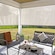 Motorized Outdoor Shades shown in Signature Pebble