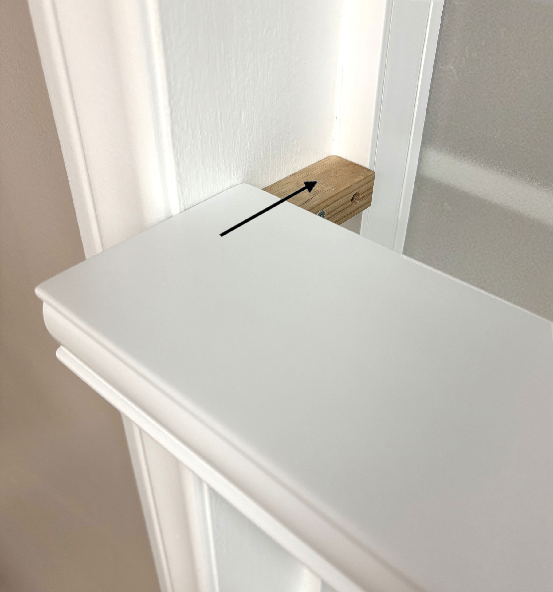Once the mounting blocks are installed on both sides of the window frame, gently align the shelf and slide it into place.