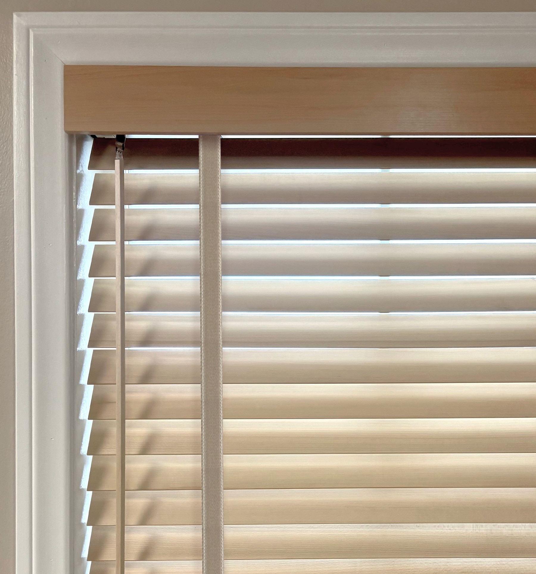 Decorative cloth tapes are available in two styles. Cloth tapes add a finished, sleek look while helping to dim light seepage through the corded ladder when the slats are closed.