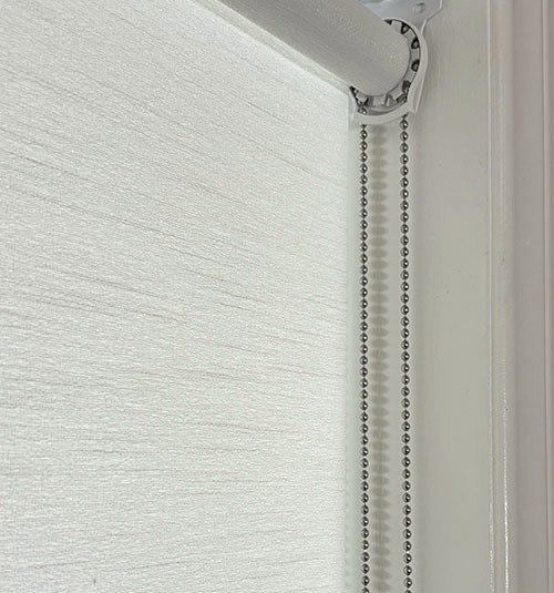 Roller shade with Cord Loop Lift. Control side can be made on either Right or Left