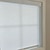 Inside Mount Light Filtering roller shade with True Square Cassette in White. Fabric shown in Cascade White