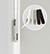 Close up of Cord Loop ?Tensioner. Tensioners ?must be wall mounted to ?operate shade. Tension device is ?color-coordinated ?to your fabric selection