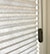 Cord Loop shades come with a tensioner that must be mounted to the frame or wall to operate properly. Tensioner color will be coordinated to the selected fabric.
