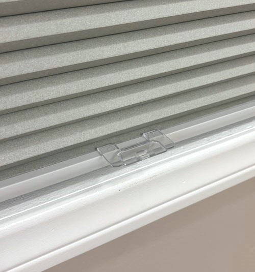 Close up of bottom rail. Cordless shade will come with a clear attachable handle.