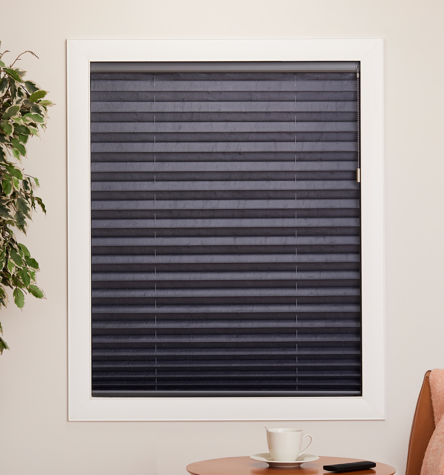 Blindsgalore Pleated shade with Motorized lift shown in Textured Steel