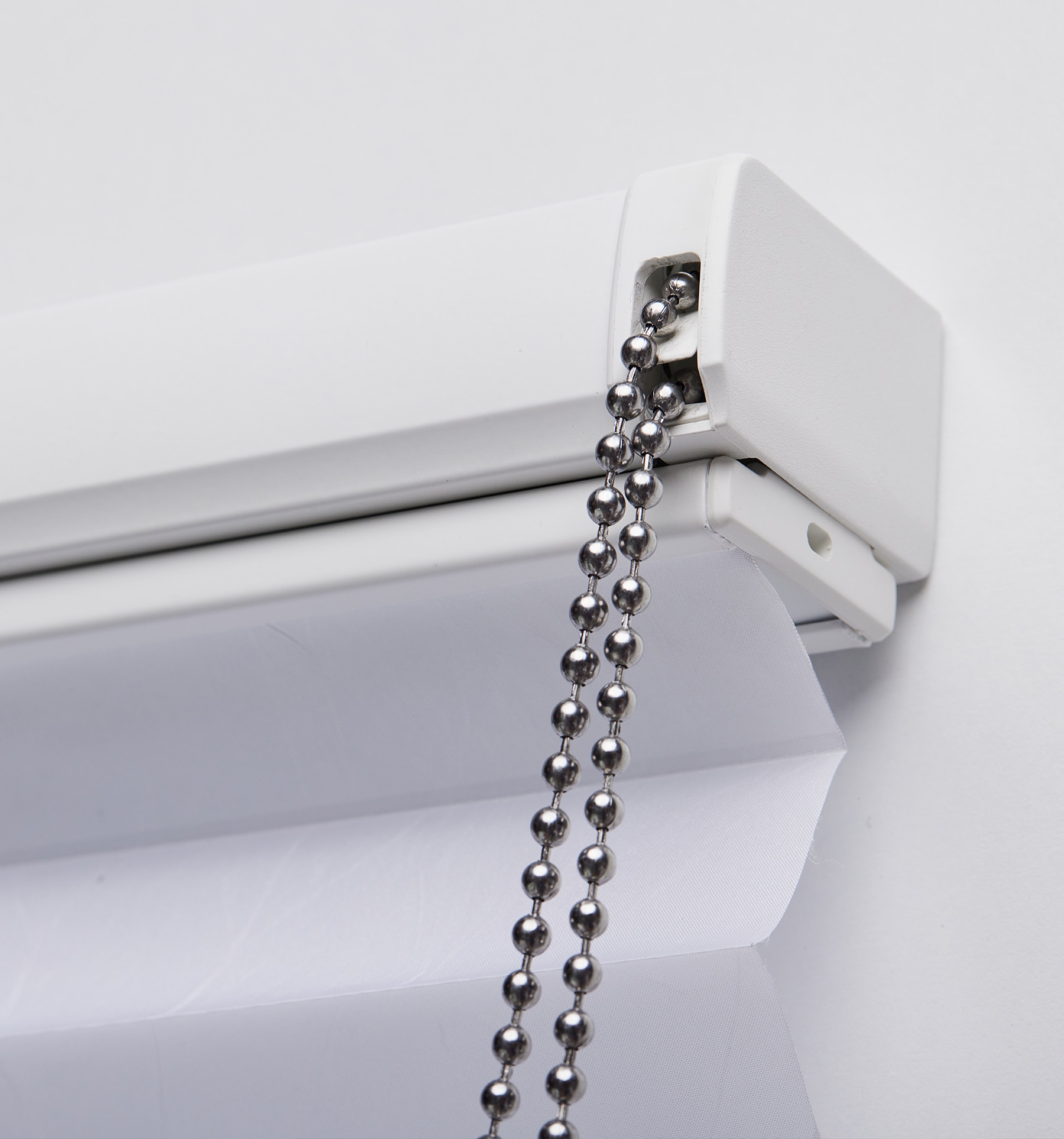 Up close of continuous chain loop and headrail.