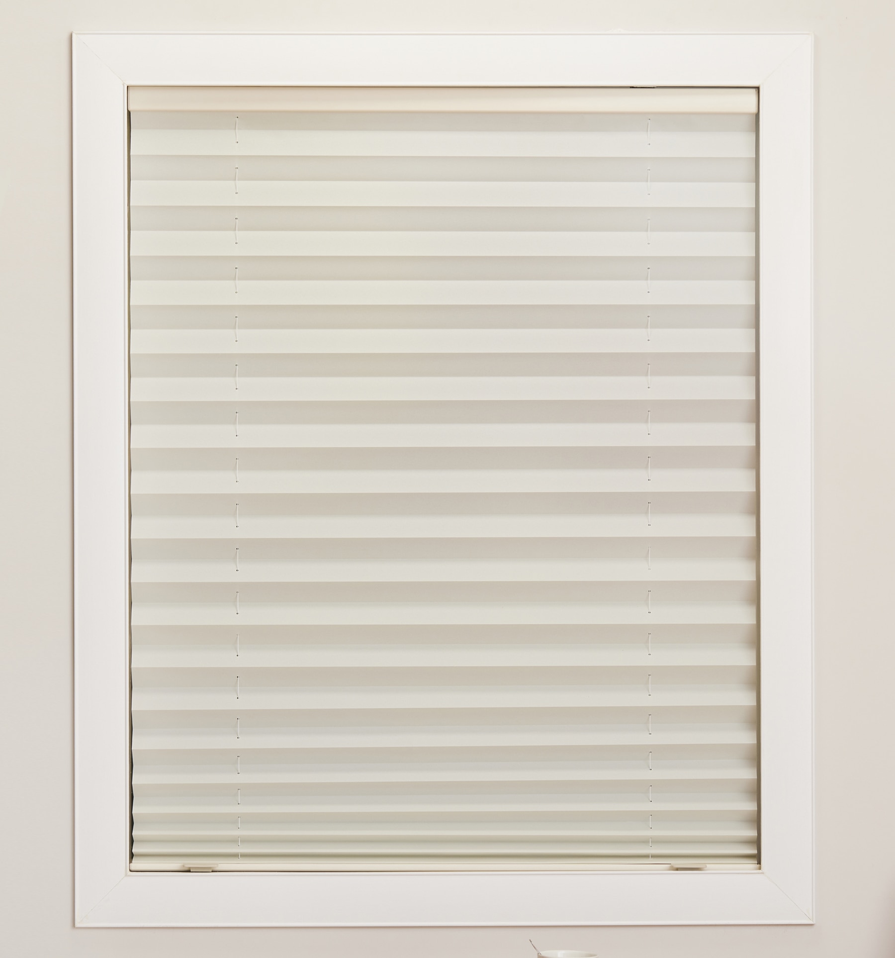 Blindsgalore Pleated shade with cordless lift shown in Solid Natural