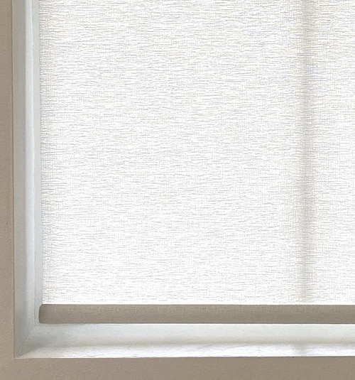 Close-up of bottom Fabric-Wrapped Hem Bar. Other hem bar options include Sewn-In and Decorative.