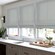 Blindsgalore Luxera Roman Shades with Knife Pleat Fold shown in Brushed Linen Mineral.