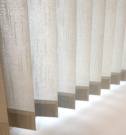 Close up of free hanging Fabric vanes. Free hanging vanes come standard with sewn-in bottom weights