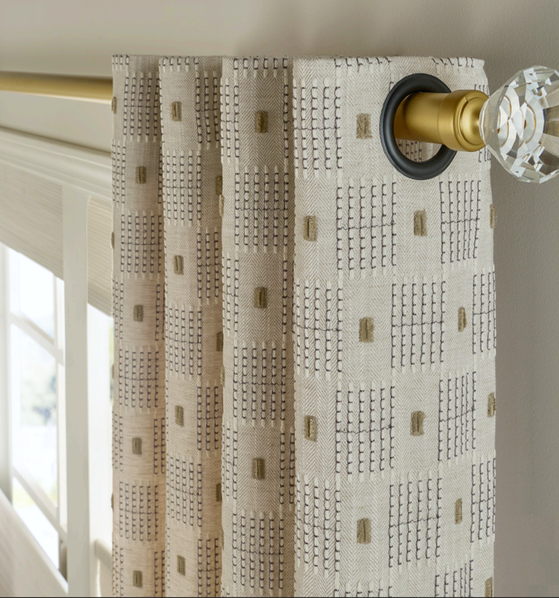 Close up of Grommet Drapery header with black grommet rings.