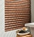 Boutique 2&quot; Faux Wood Blinds shown in Pau Ferro Close Up