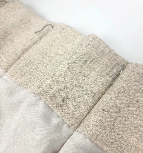 Back of pinch pleat panel showing pre-pinned pin set.