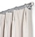 Close up of pinch pleat curtain panel with silver attachment rings