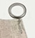 Close up of silver pinch pleat attachment ring on pin.